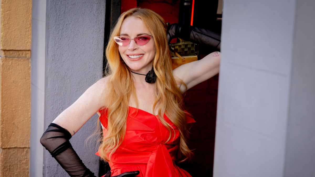 Lindsay Lohan posing in a red dress in Freakier Friday.