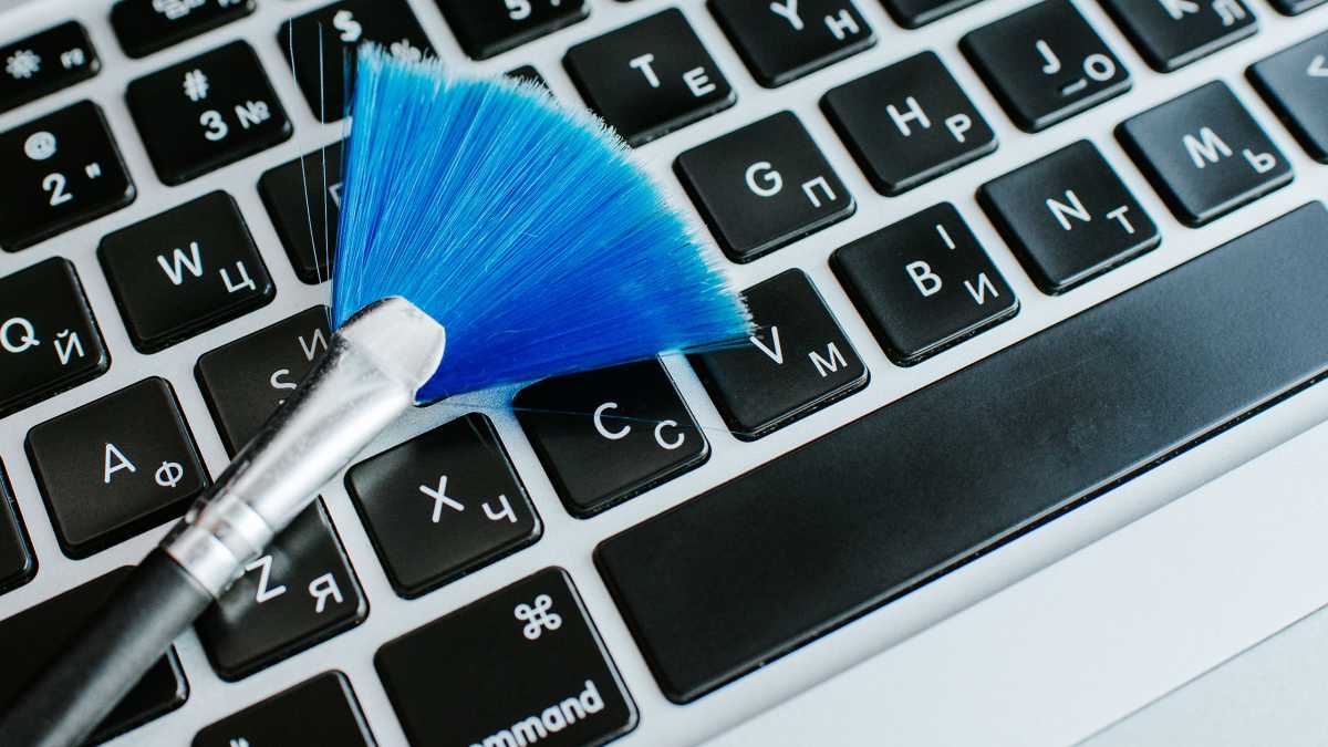 Brush on keyboard for PC cleanup