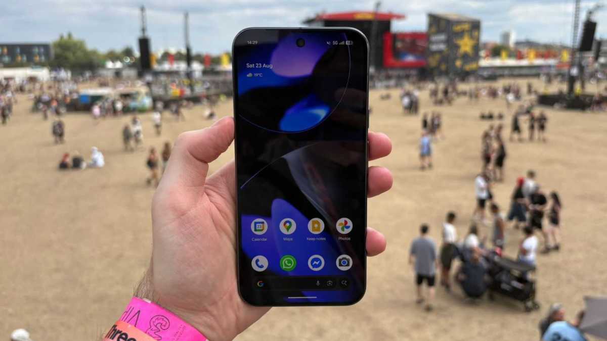 Google Pixel 10 Pro XL with Reading Festival main stage in the background