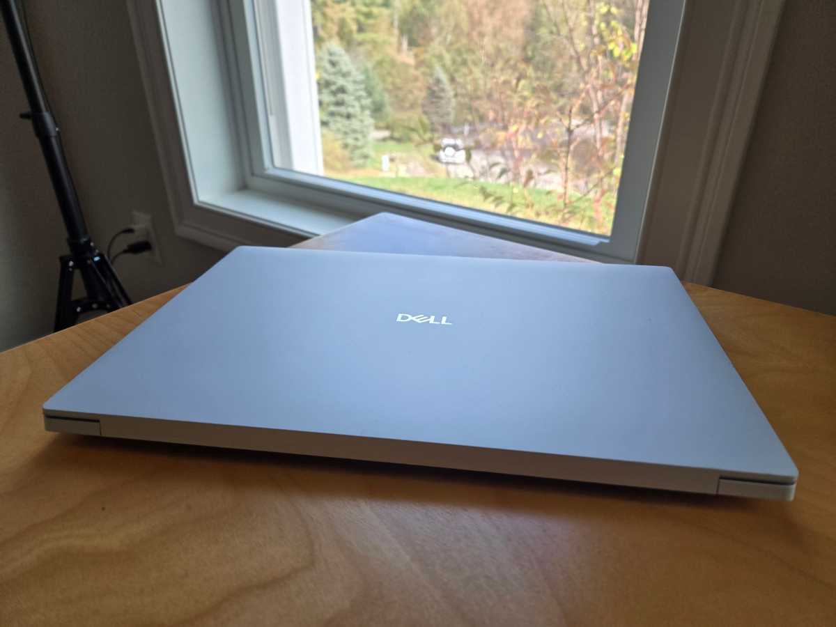 Dell 16 Premium in front of window