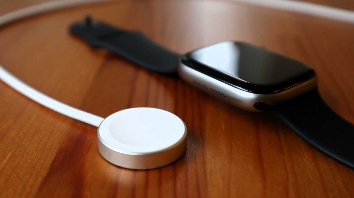 The Apple Watch Series 11 with its charging puck