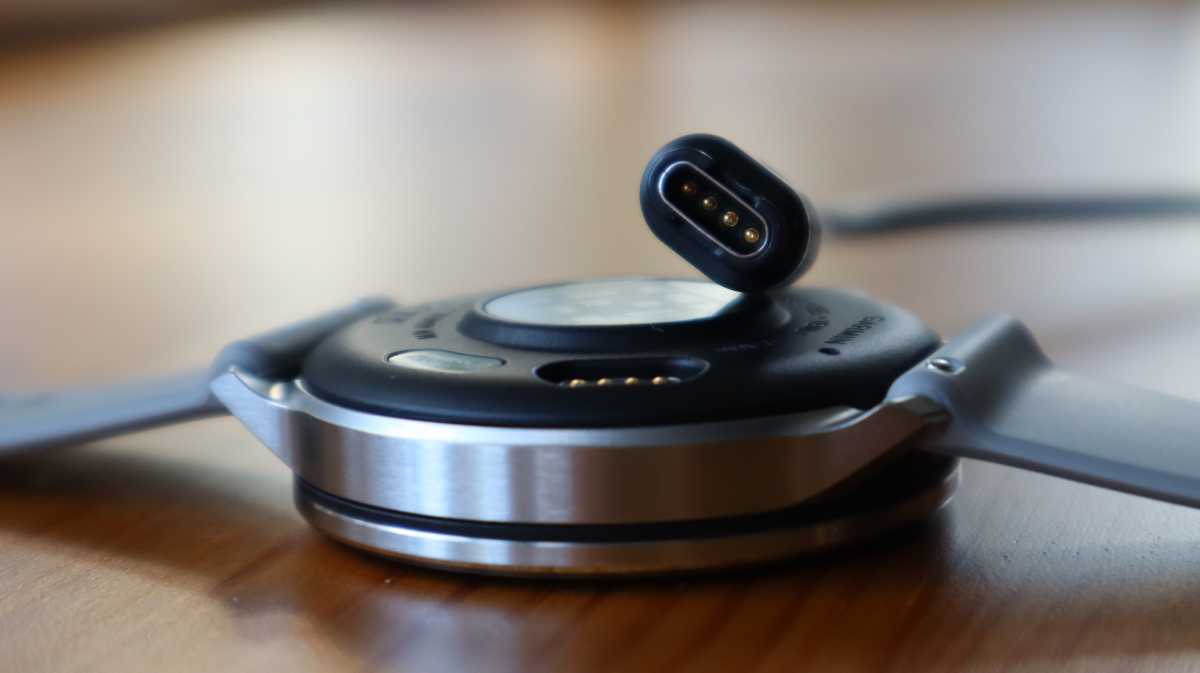 Garmin Venu 4 with the included charger