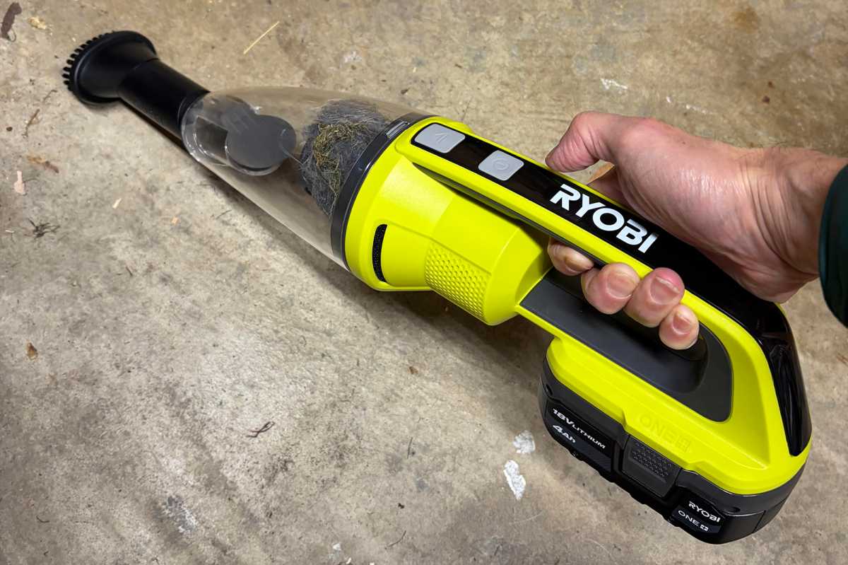 Using a Ryobi 18V Hand Vacuum, cleaning debris