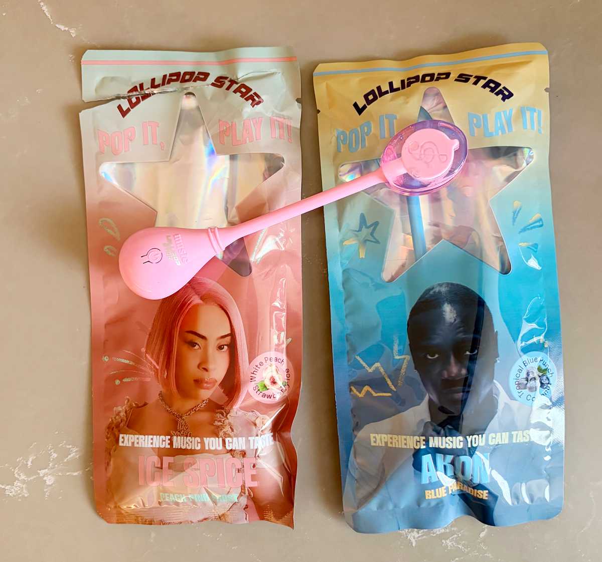 Two Lollipop Stars in packaging. Ice Spice and Akon.