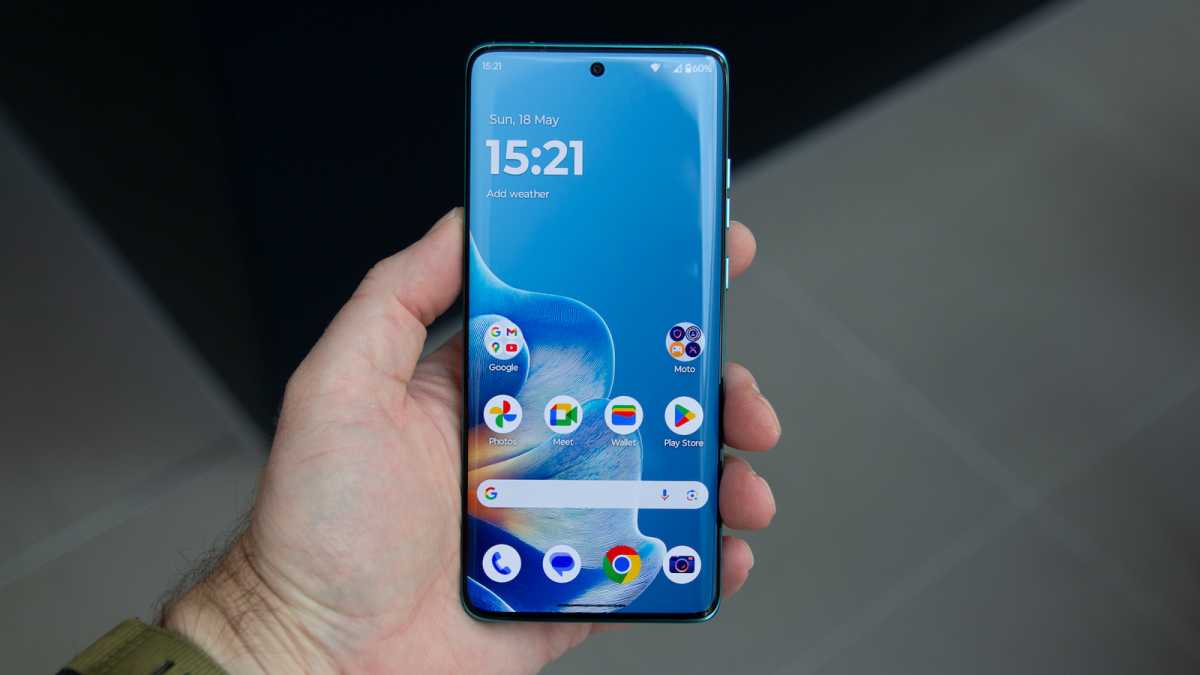 Motorola 60 Edge Fusion in a hand, showing the display