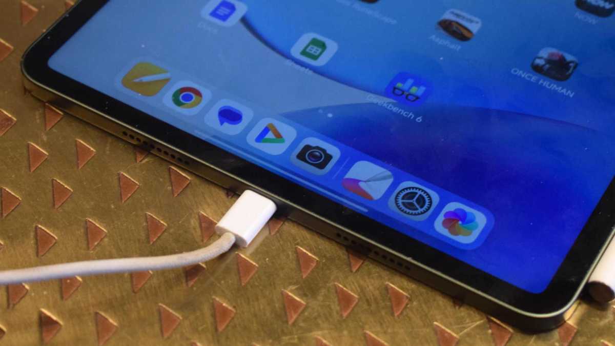 The Xiaomi Pad 8's charging port, with a wire connected.