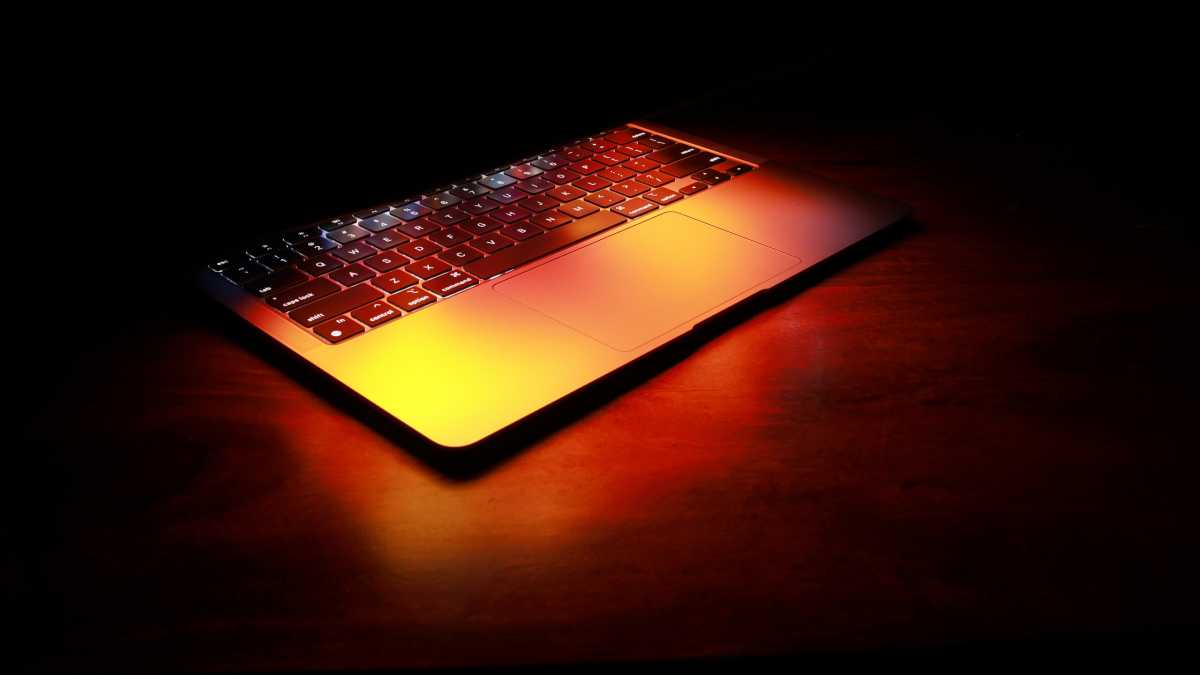 Laptop in darkness glowing orange with heat