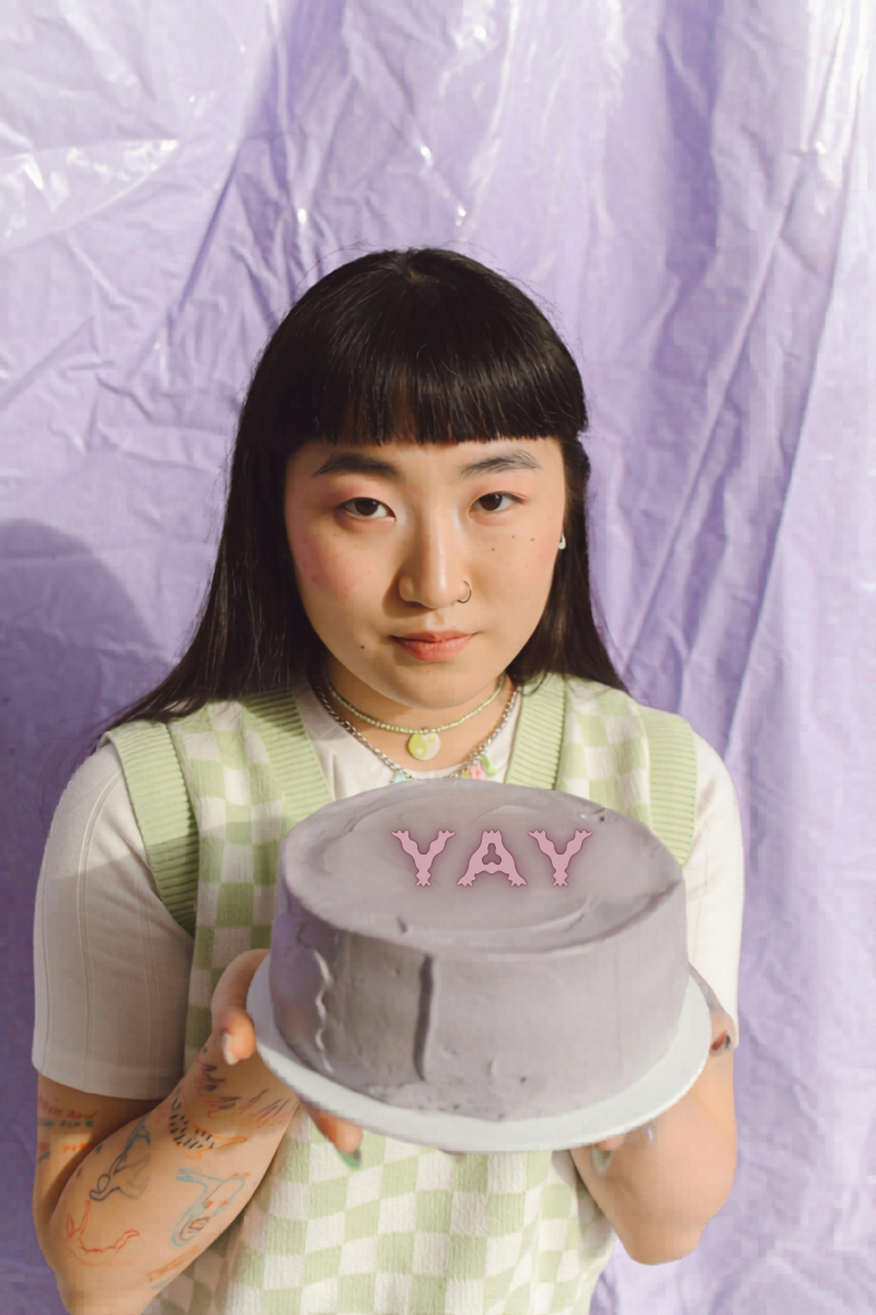 bored GenZ girl holding cake