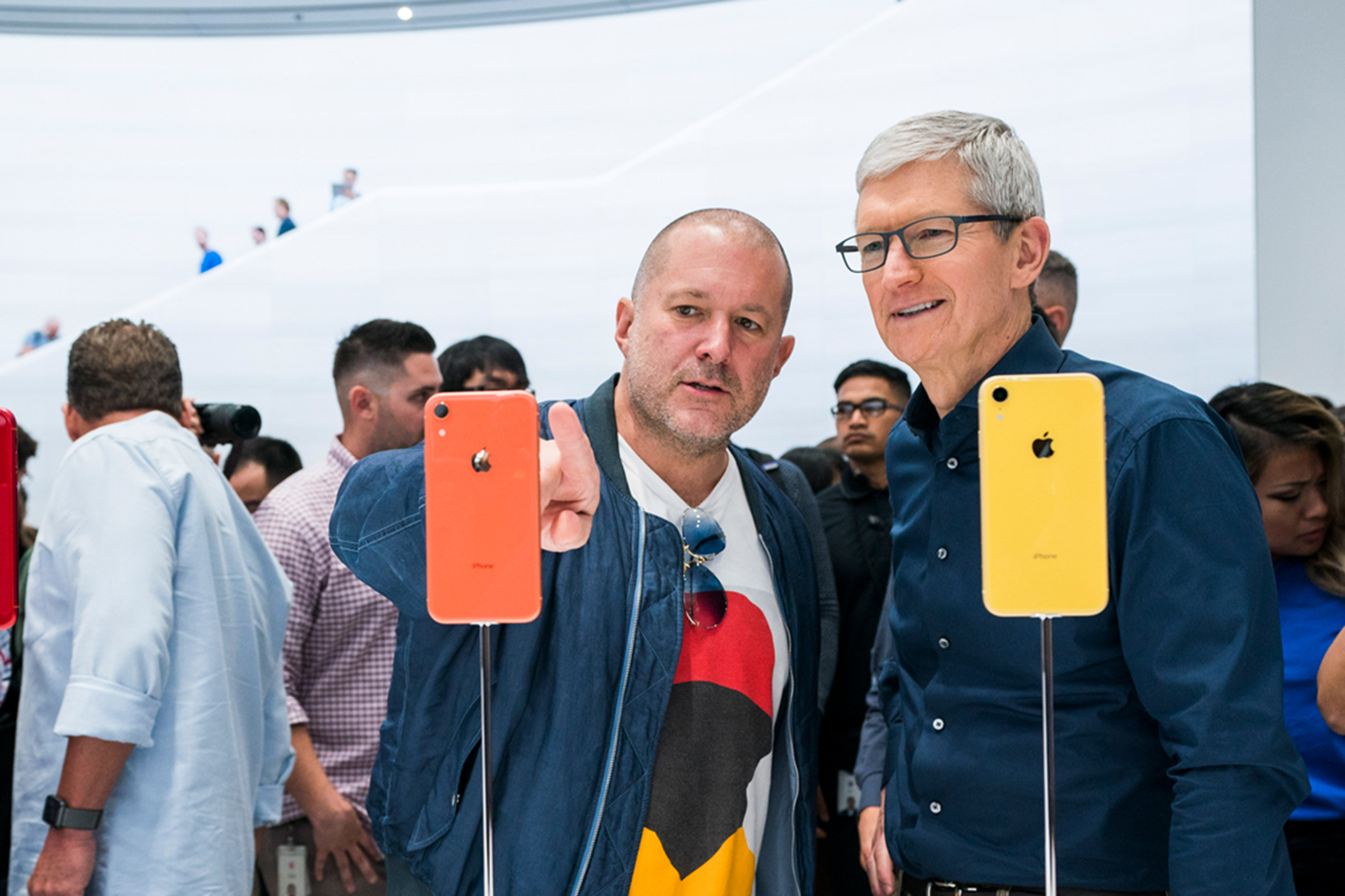 Tim Cook and Jony Ive looking at the iPhone 5c