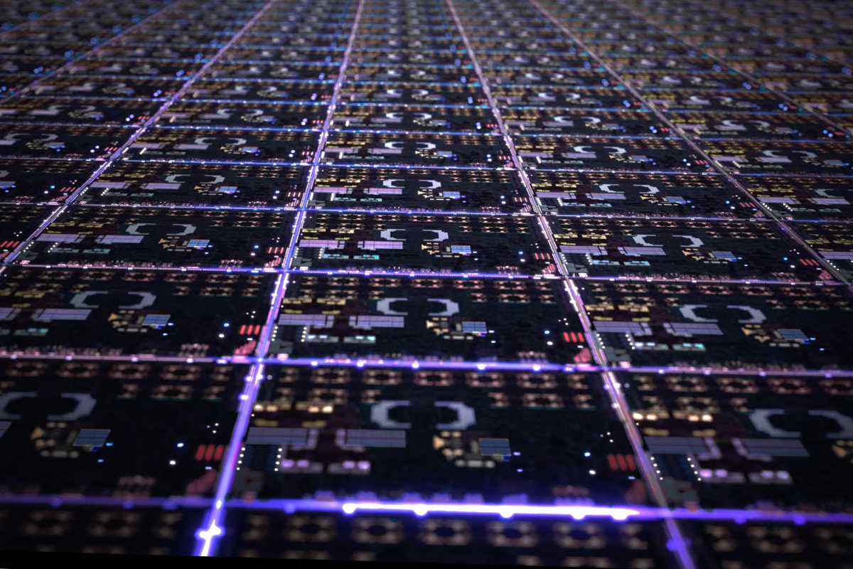 Apple showing hundreds of apple silicon chips on a wafer