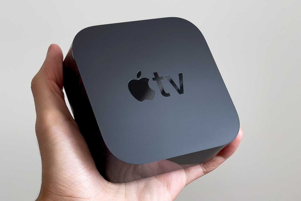 person holding an Apple TV 4K