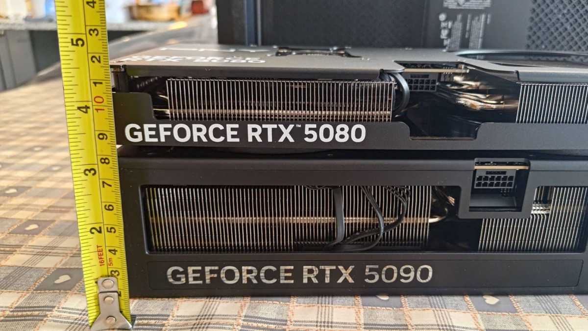 GeForce RTX 5080 stacked on RTX 5090 with rule measurement thickness