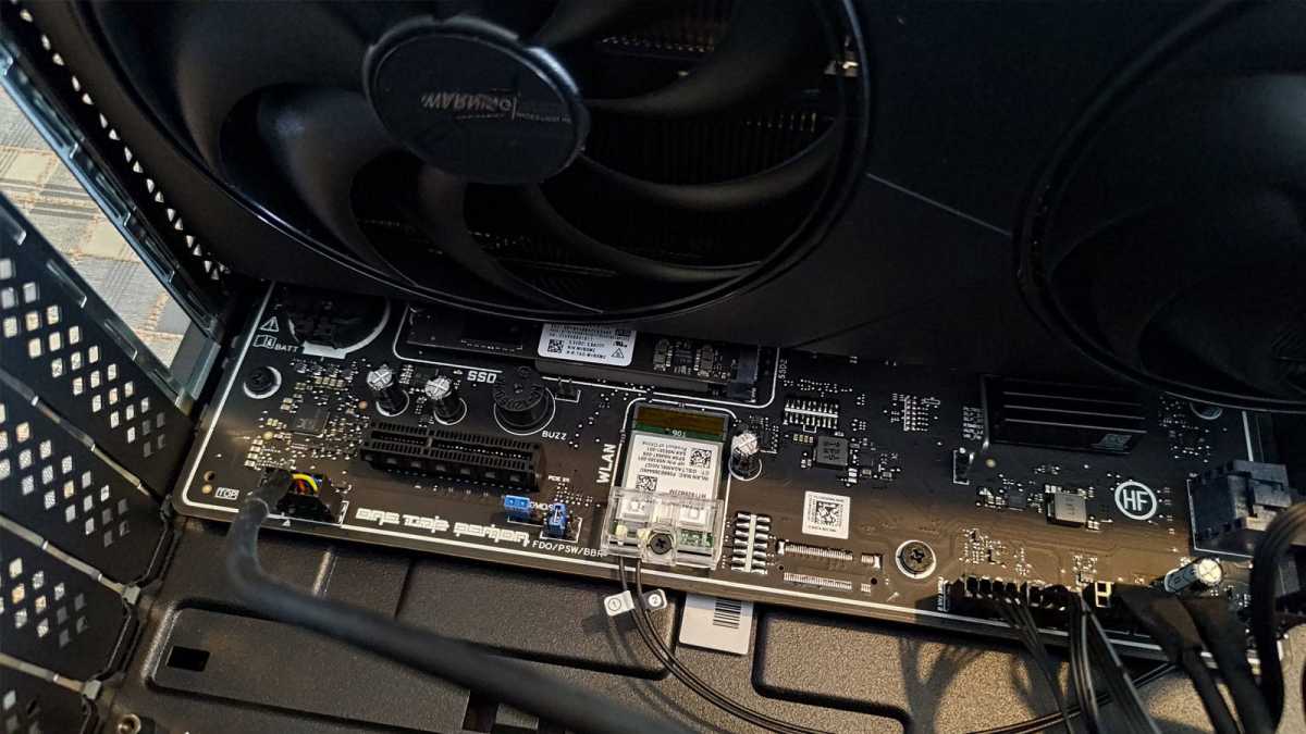 PNY RTX 5080 Slim installed next to motherboard closeup