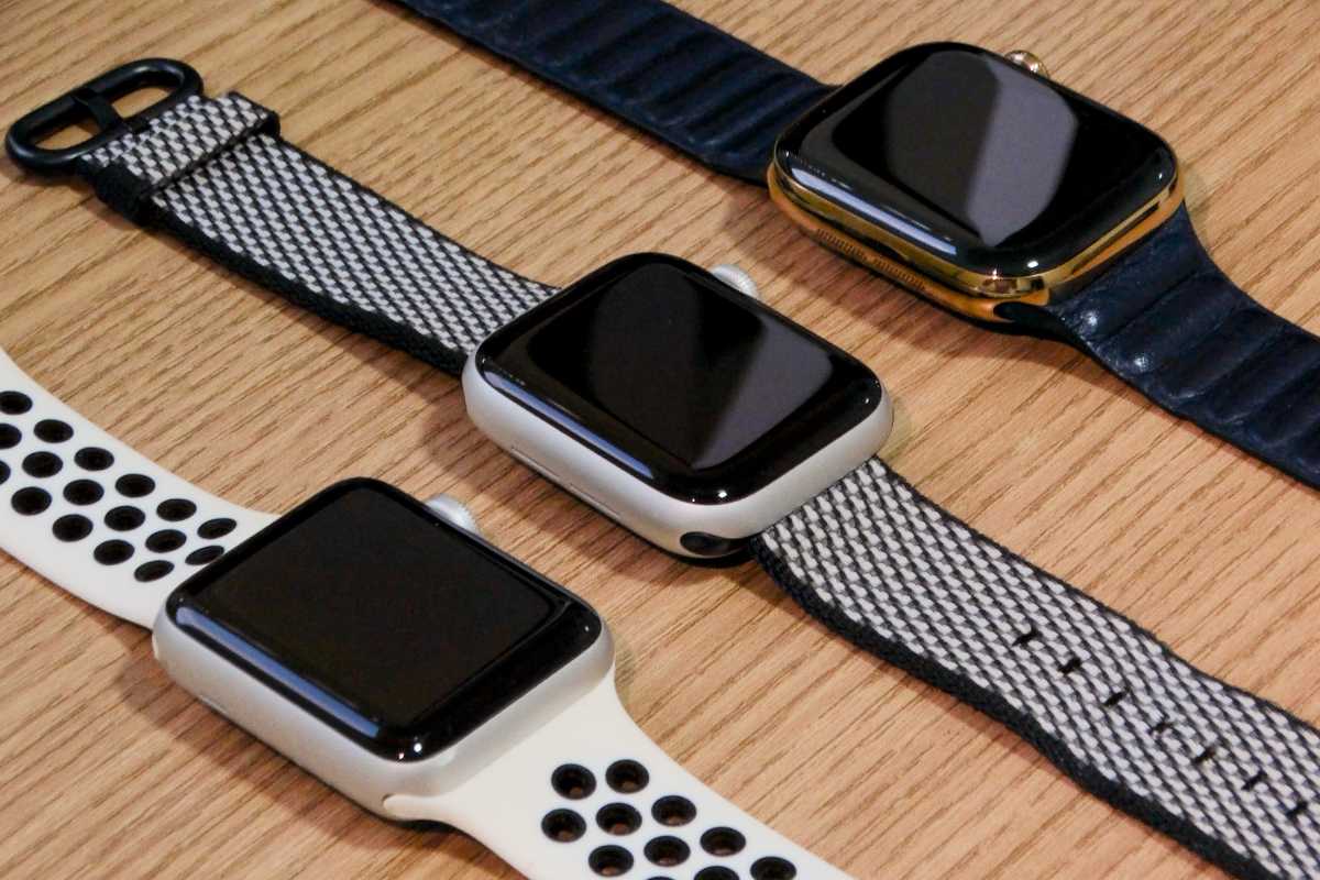 various models of Apple WAtch resting on a tablet