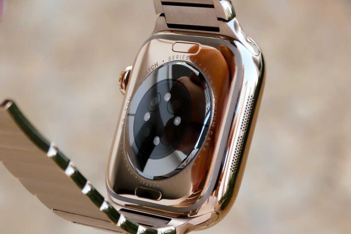 Apple Watch held to show heart-rate sensor