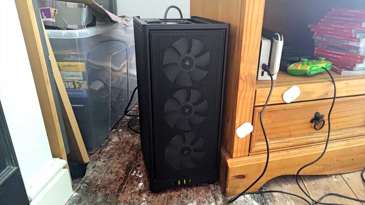 Completed DIY Steam Machine standing next to wooden stand