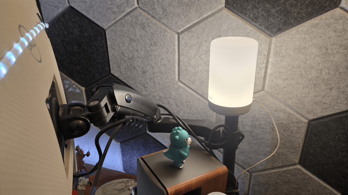 Wi-Fi light behind Michael's desk, also there's a chibi godzilla there, god it's so dusty