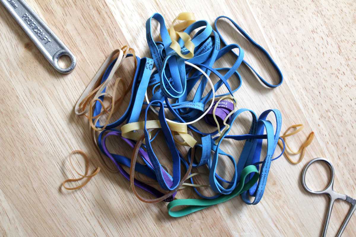 Pile of rubber bands on a wood table