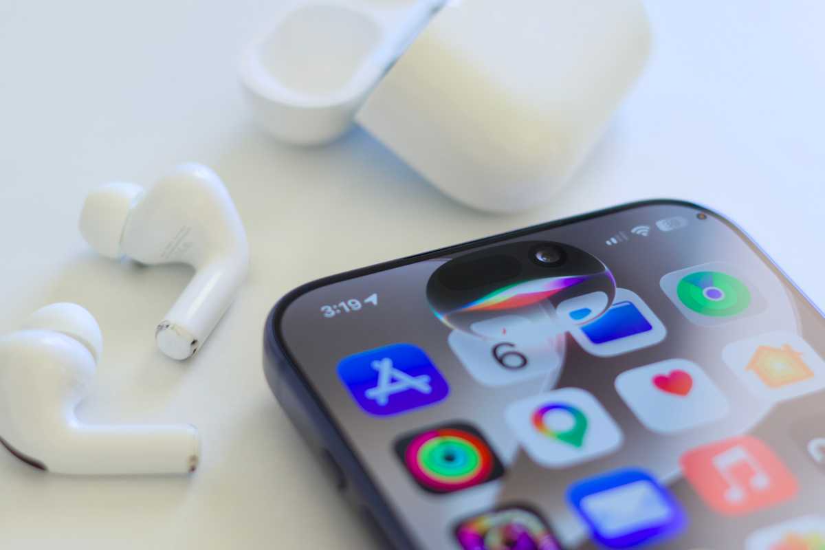 AirPods Pro 3 next to Siri AI on iPhone 17 Pro Max