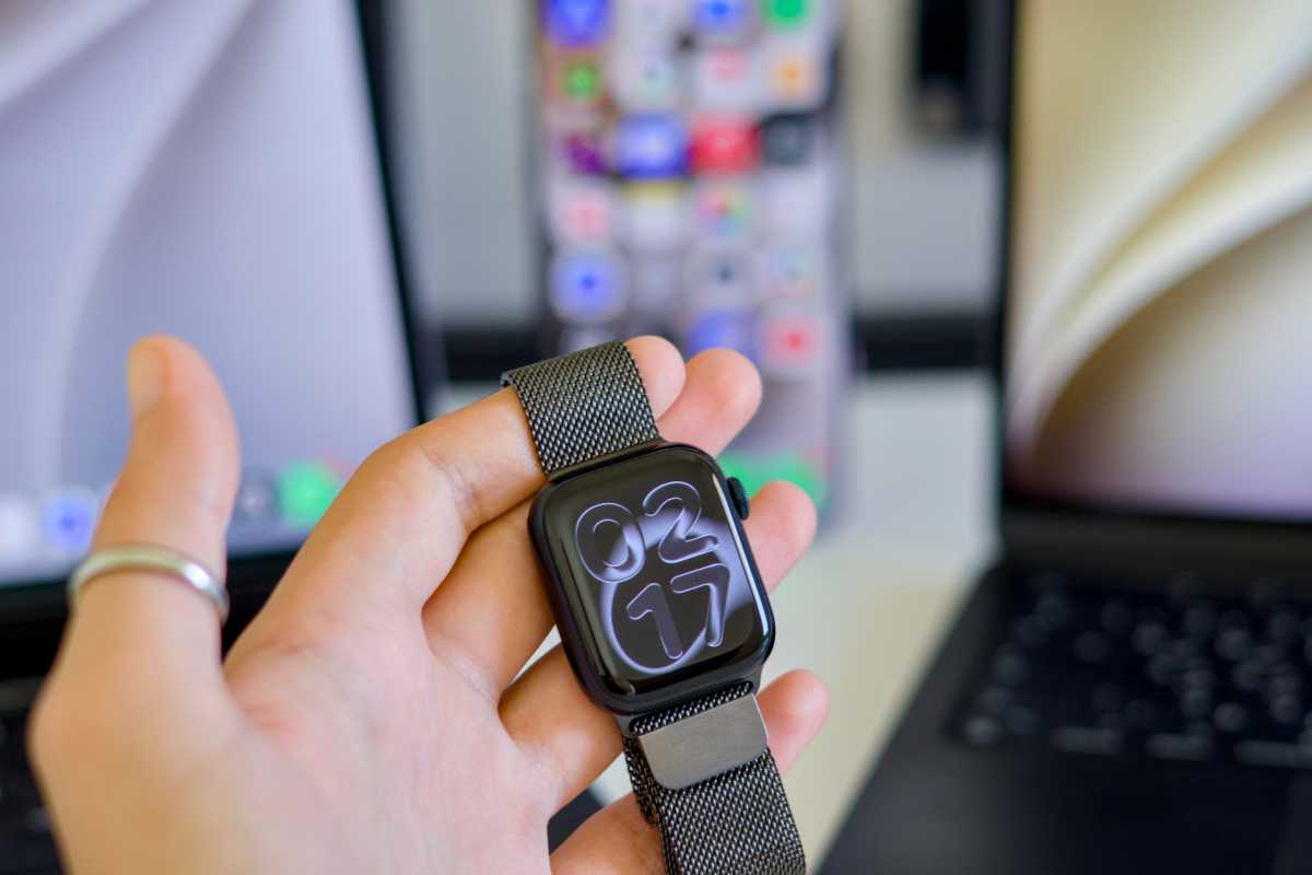 Apple Watch surrounded by rectangular computing devices