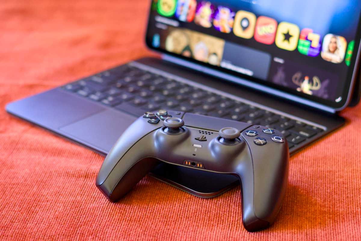 Sony DualSense Controller next to Apple Games on iPad Pro M4