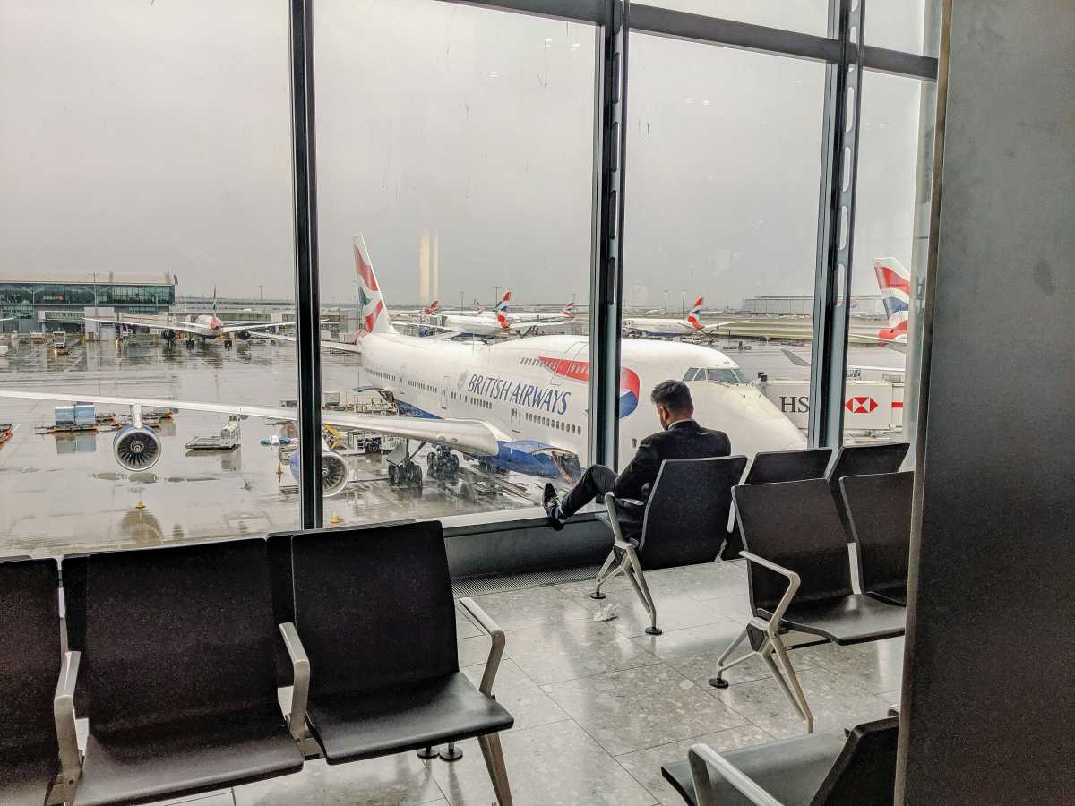 Man in a suit waiting at an airport