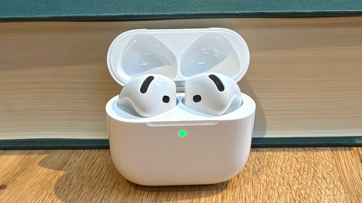 AirPods 5 buds charging in an open case