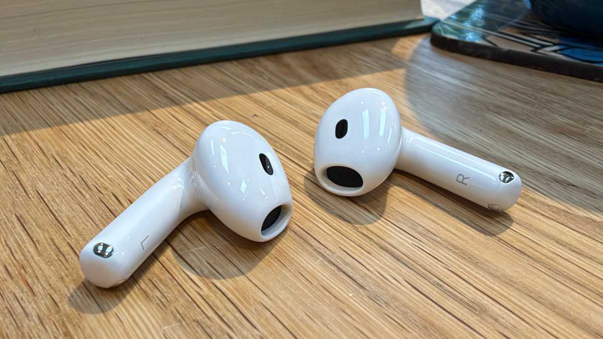 AirPods 5 left and right earbuds out of their case
