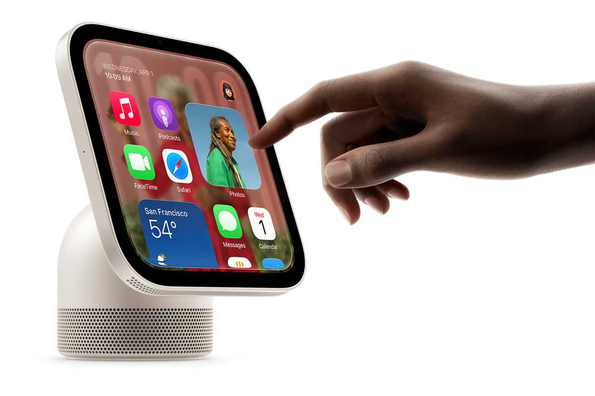 person touching the screen of an APple HomeView
