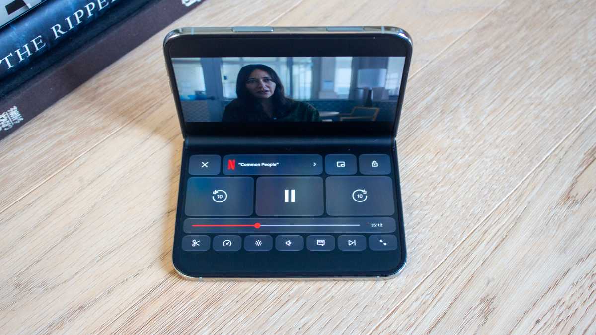 iphone Duo on a table in deated view showing a video with controls