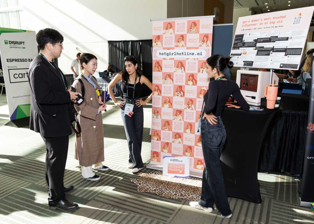 Sumi and Baila Mudgil, co-founders of HotGirlHotline.AI, chat with Disrupt attendees.