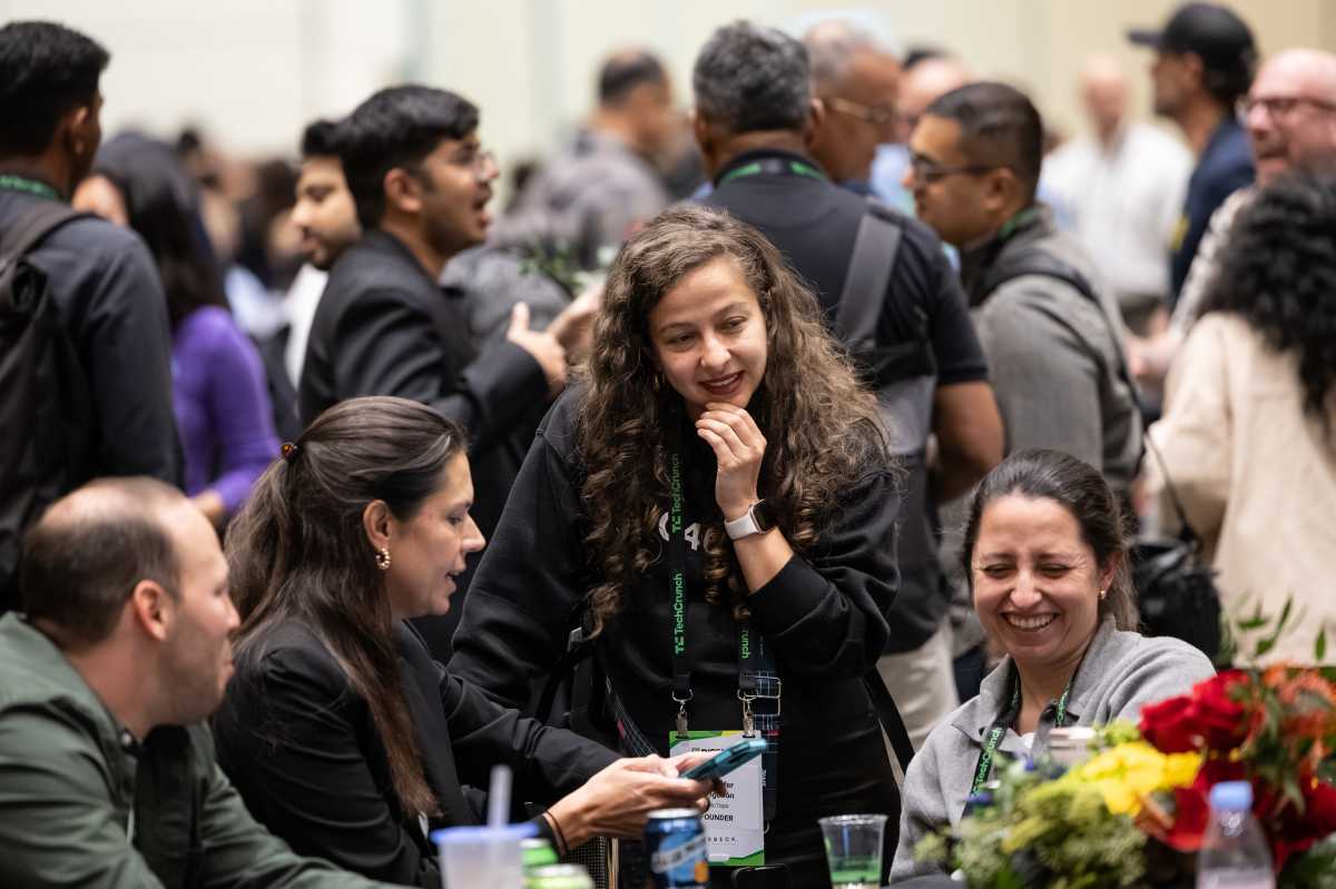TechCrunch 2026 attendees talking and laughing