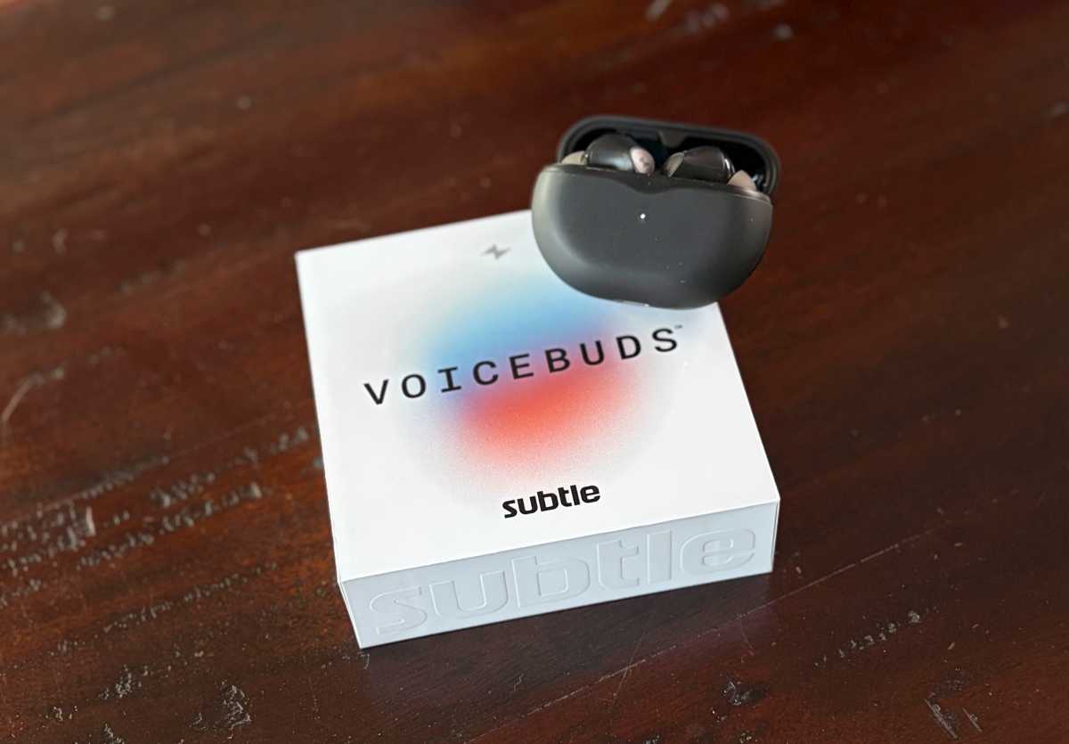 The Voicebuds box with a pair of Voicebuds sitting in their charging case on top.