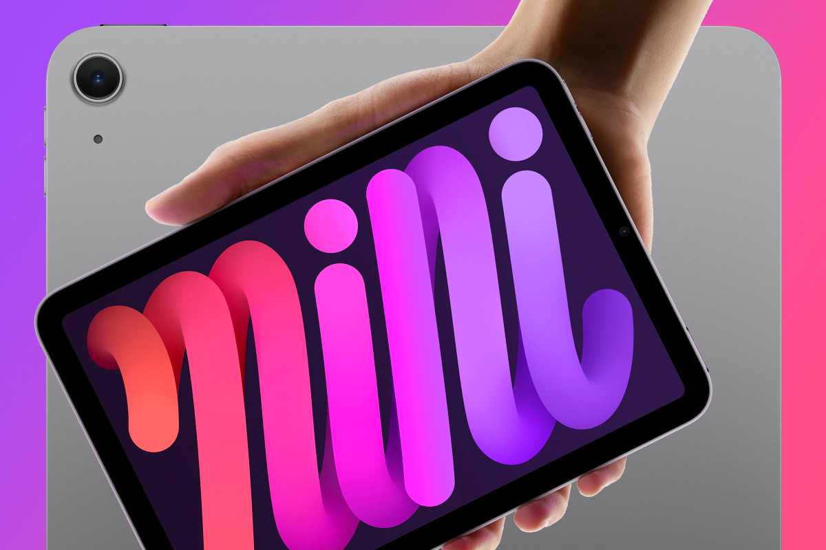 iPad mini being held over the back of an iPad Air in space gray